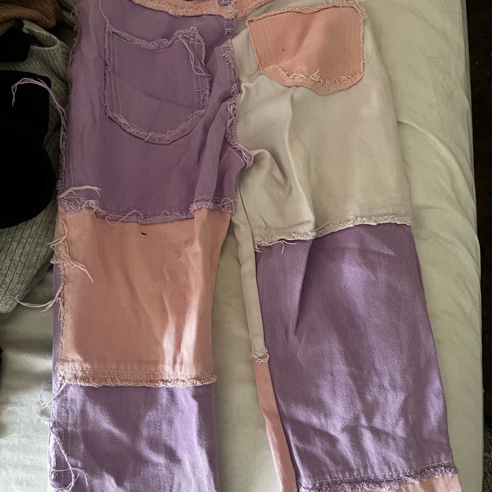 Pink white and purple jeans